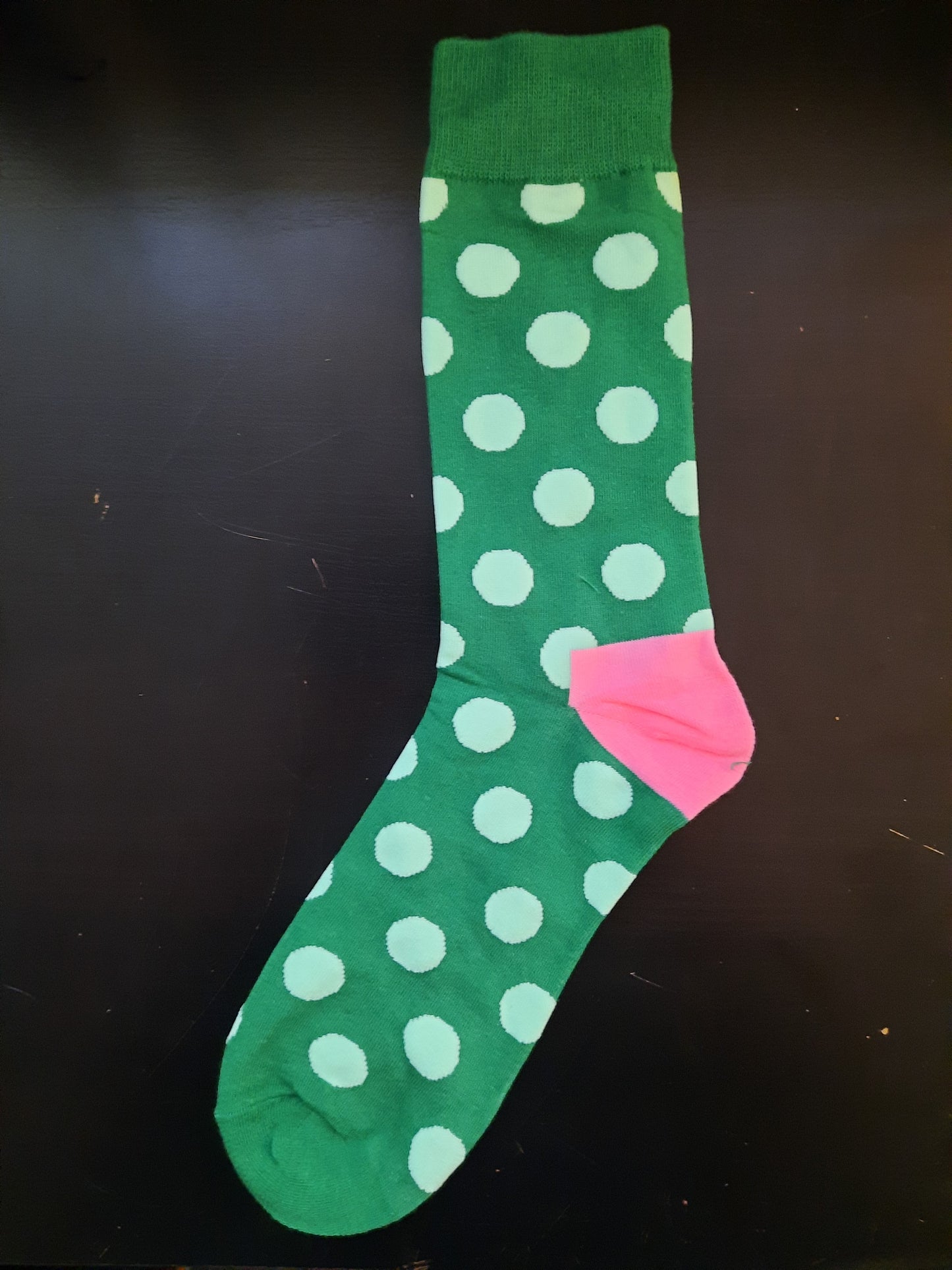 Green socks with light green polka dots