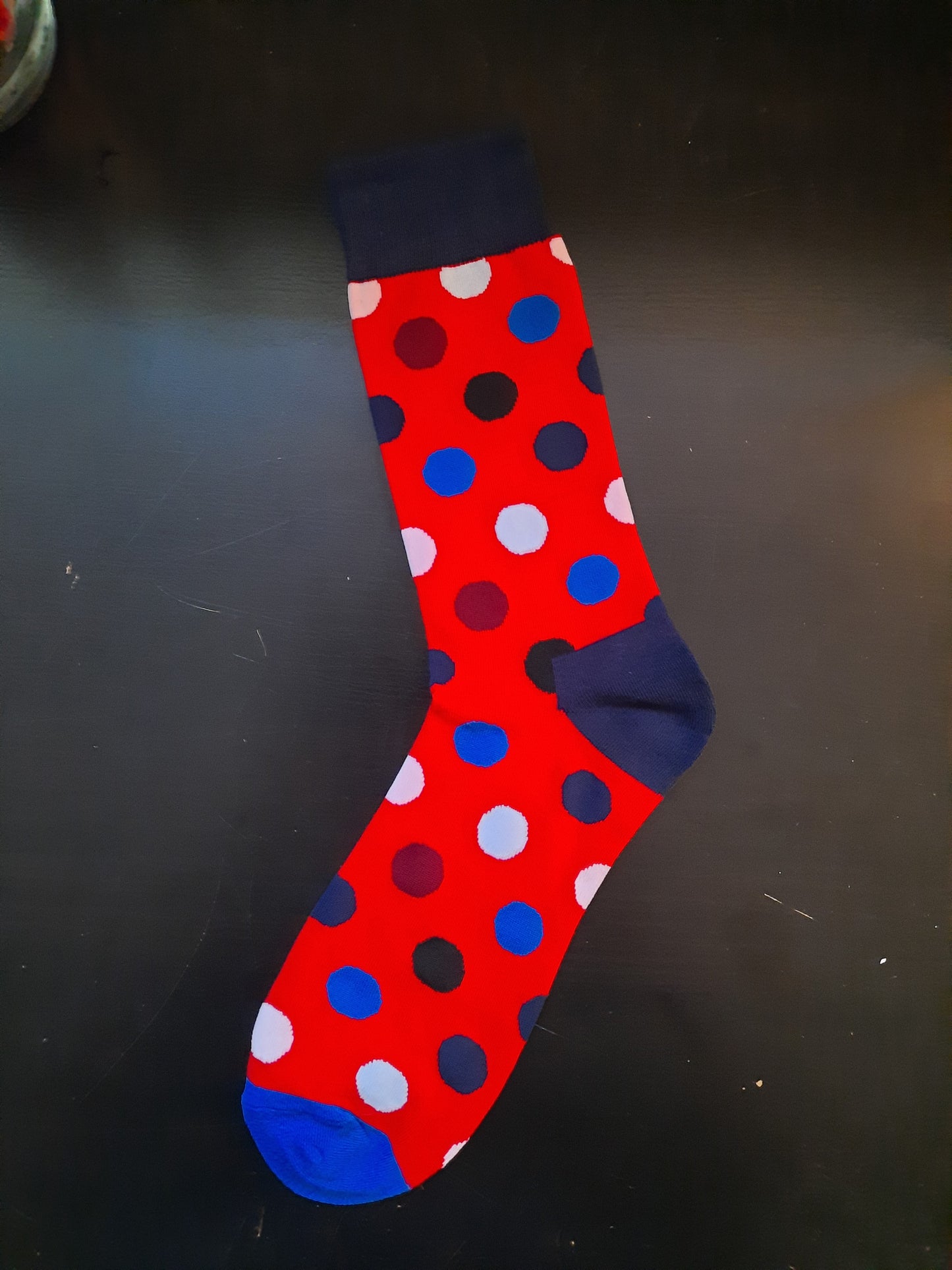 Red socks with multi-colored polka dots