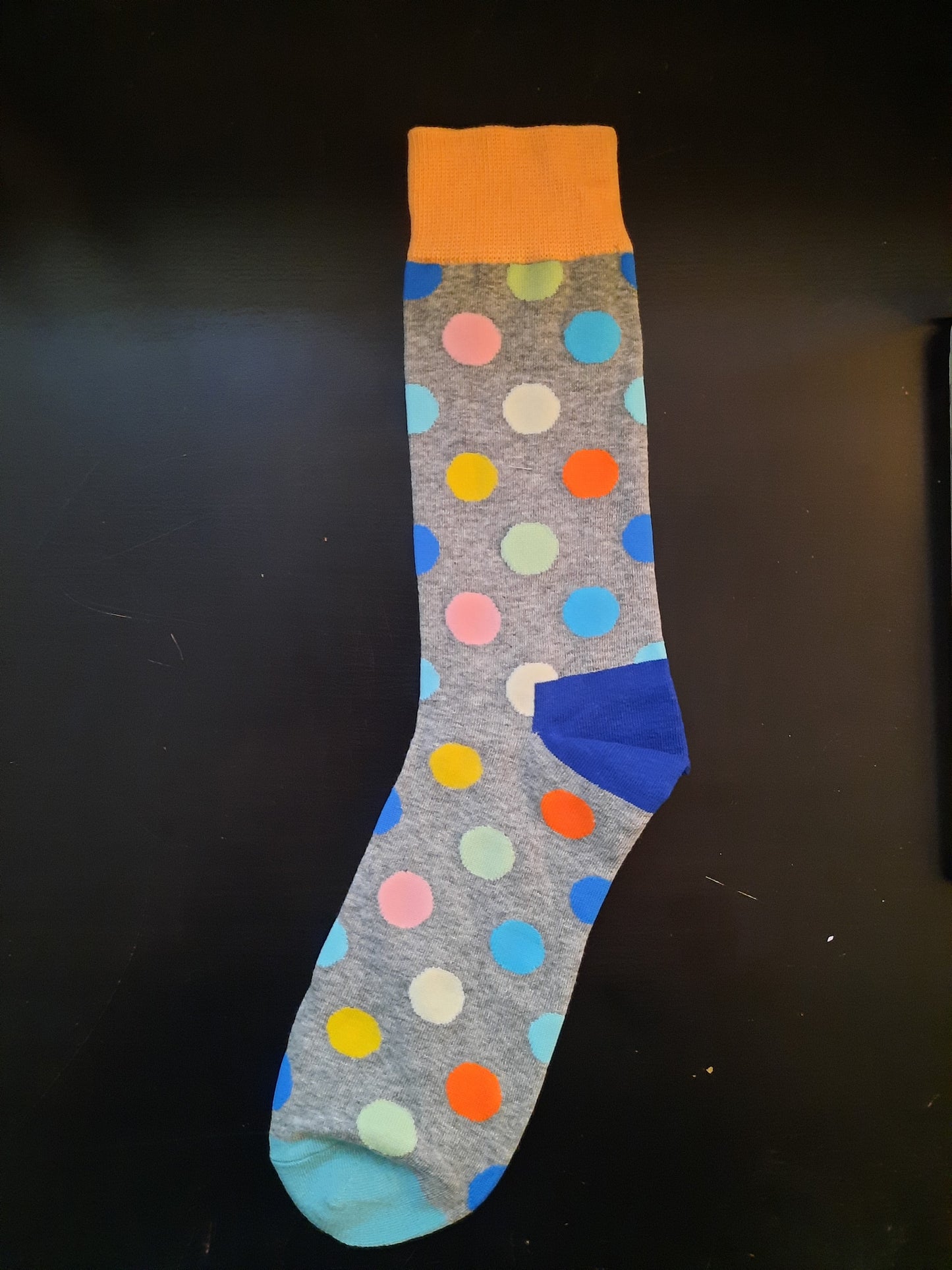 Grey socks with multi-colored polka dots