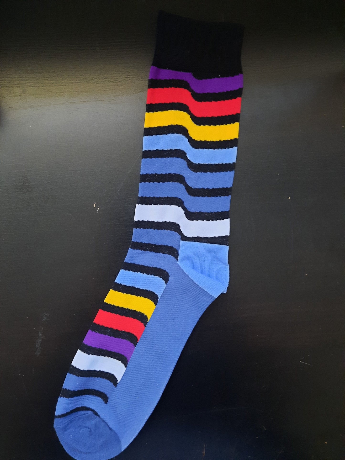 Blue socks with purple, red, yellow, light blue, dark blue, white Waves - Black top