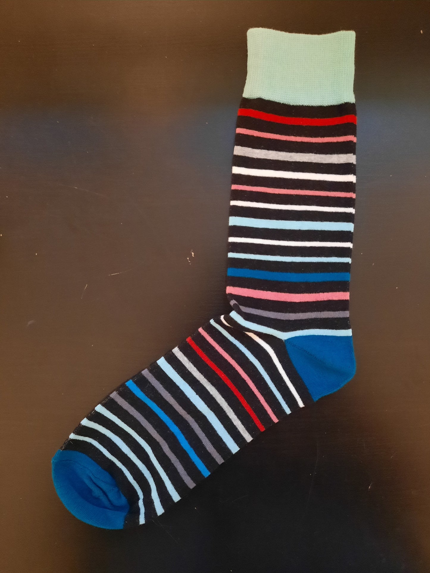 Green, teal, red, orange, grey, striped socks with mint color top socks