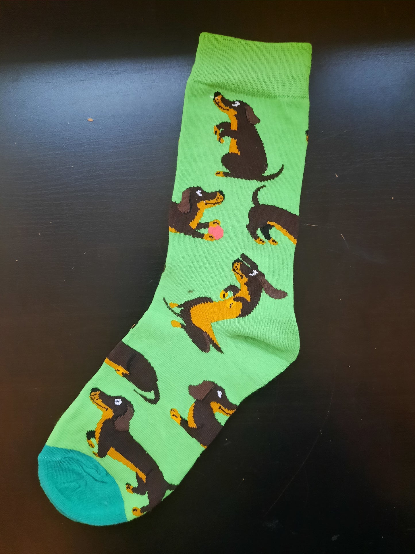 Green socks with weiner dogs